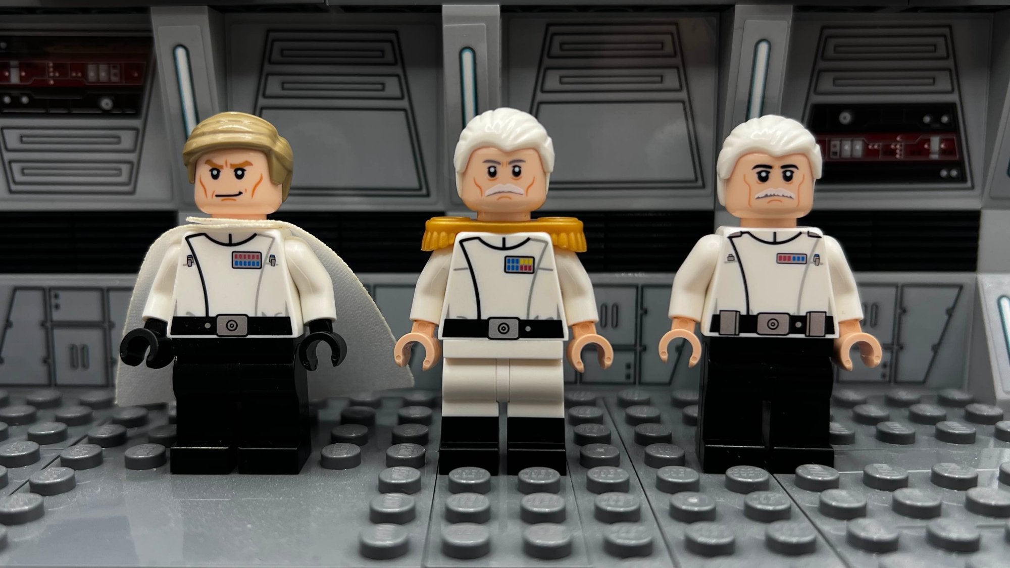 Custom LEGO minifigures of Imperial officers, featuring detailed designs with white uniforms, rank insignia, and unique facial expressions. Displayed in a Star Wars-themed diorama with a metallic gray background. Perfect for fans of Star Wars and LEGO collectors.