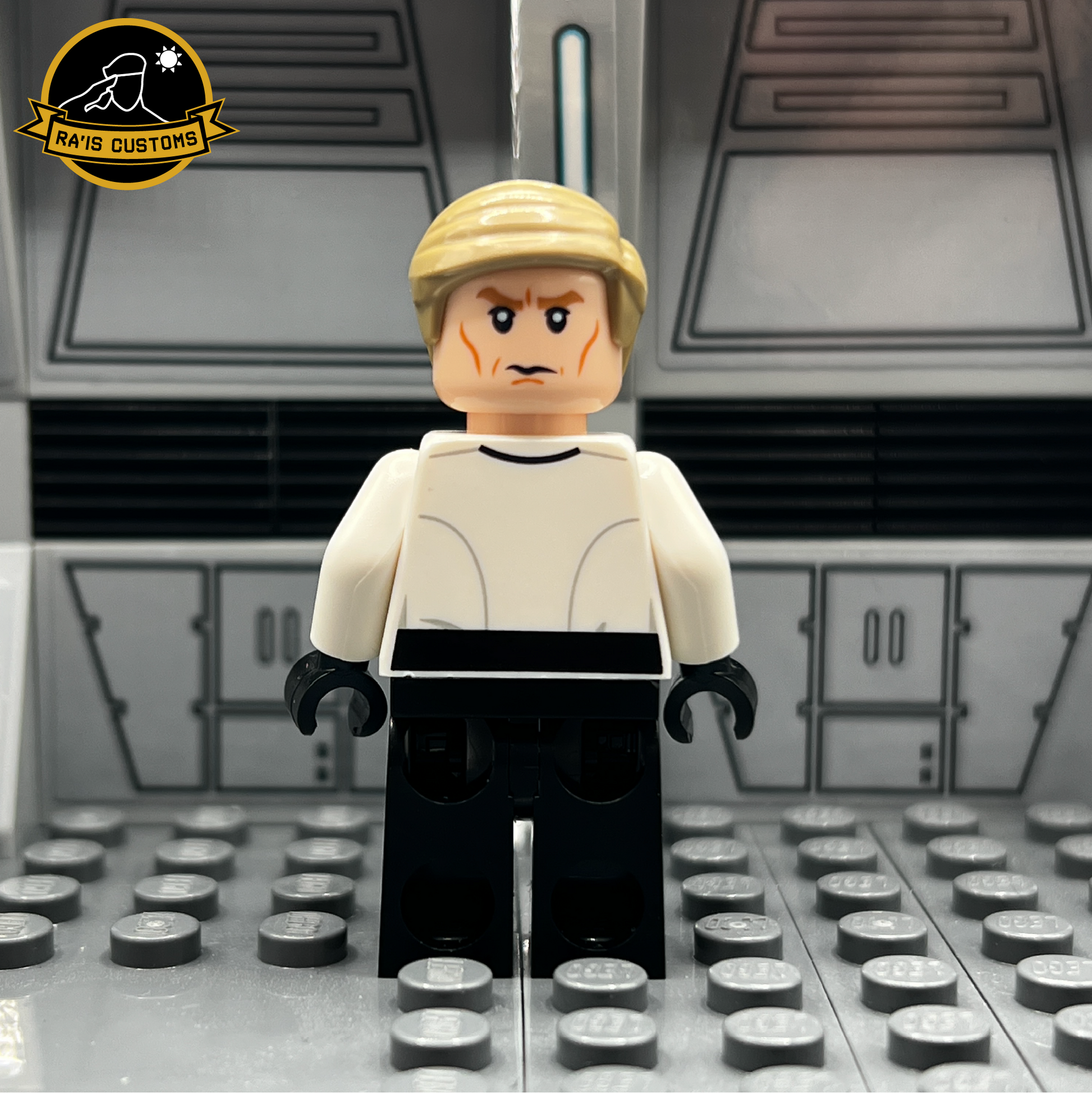 Rear view of a custom LEGO minifigure of Director Krennic from Star Wars: Rogue One, created by Ra'is Customs. Showcasing the detailed back design of the white uniform and blonde hairpiece, set against a Star Wars-themed diorama with a futuristic gray background. Ideal for collectors and fans seeking high-quality, custom-designed LEGO minifigures.